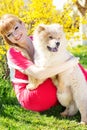 Girl With Her Dog On The Nature