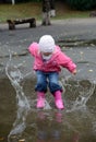 Girl Jumping In Puddles