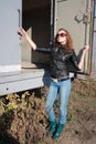 Girl poses near the iron trailer