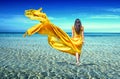 Girl in a yellow dress in sea