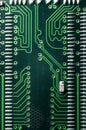 Green circuit board with binary numbers and cells on it close up photo Royalty Free Stock Photos