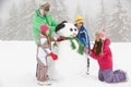 Group Of Children Building Sno...