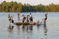 Group Of Kids Jumping Into Lake