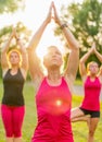 Group Of 3 Women Doing Yoga In...