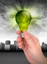 Hand Holding Green Energy Ligh...