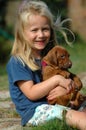 Happy Little Girl With Puppy