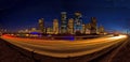 Houston skyline at night with highway traffic