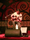 An Indian guitarist playing live in concert Stock Photos