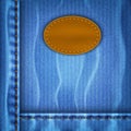 Jeans background with a leather label blue shabby Royalty Free Stock Images