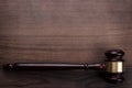 Judge gavel on the brown wooden background