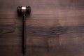 Judge gavel on the brown wooden background