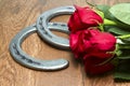 Kentucky Derby Red Roses with Horseshoes on Wood