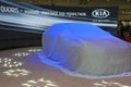 Kia quoris new car model before start of presentat korean covered by white sheet presentation on display sia kyiv international Stock Photos