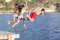 Kids Jumping In Ocean