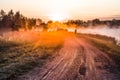 Landscape, sunny dawn with road and fisher