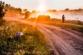 Landscape, sunny dawn with road and fisher