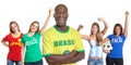 Laughing man from Brazil with four female sports fans