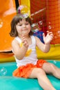 Little Girl Playing With Bubbles