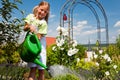 Little Girl Watering Flowers