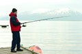 Man Fishing In Fiord