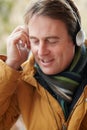 Man Wearing Headphones And Lis...