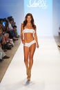MIAMI BEACH, FL - JULY 22: A model walks the runway at the Lolli Swim show during Mercedes-Benz Fashion Week Swim 2014