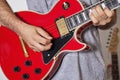 Midsection Of Man Playing Elec...