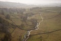 Misty morning view along Malham Beck and Dale in Yorkshire Dales