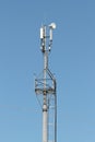 Mobile antenna reinforced concrete pillar on which four antennas for communication against the blue sky s Stock Photos