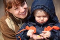 Mother with child and first flower in spring