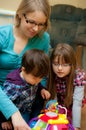 Mother And Children Playing