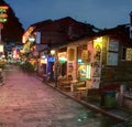 Night narrow street in small town Yangshuo, cafes, restaurants,