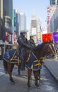 NYPD police officers on horseback ready to protect public on Times Square during Super Bowl XLVIII week in Manhattan