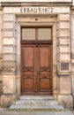 Old brown wooden door of a school