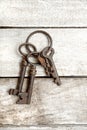 Old keys with ring on wooden background Royalty Free Stock Images