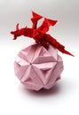 Origami dragon on paper ball