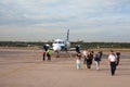 Passengers come out of the airplane Saab 304