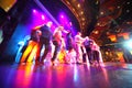 People Crowd Dance At An Illum...