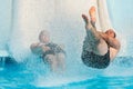 People Sliding At Water Park