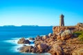 Ploumanach lighthouse sunset in pink granite coast, Brittany, France.