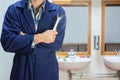 Plumber In Blue Boiler Suit Po...