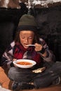 Poor Beggar Child Eating Chari...