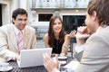 Business People Meeting In Cafe.