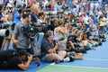 Professional photographers on tennis court during trophy presentation at the Arthur Ashe Stadium at US Open 2014