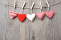 Red Hearts Hanging Over Wood B...