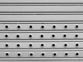 Roll up gate light grey painted perforated gates background Stock Photo