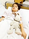 Sad child on hospital bed