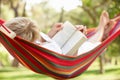 Senior Woman Relaxing In Hammo...