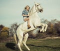 Serious Blonde Woman Riding Th...