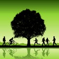 Silhouetted People Under Tree
